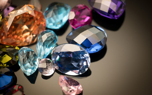 Several of the most rare gemstones laid out on a table.