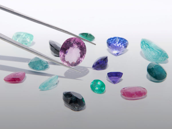 Multiple colorful rare gemstones displayed 